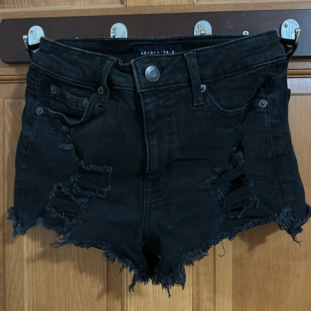 black ripped high waisted shorts